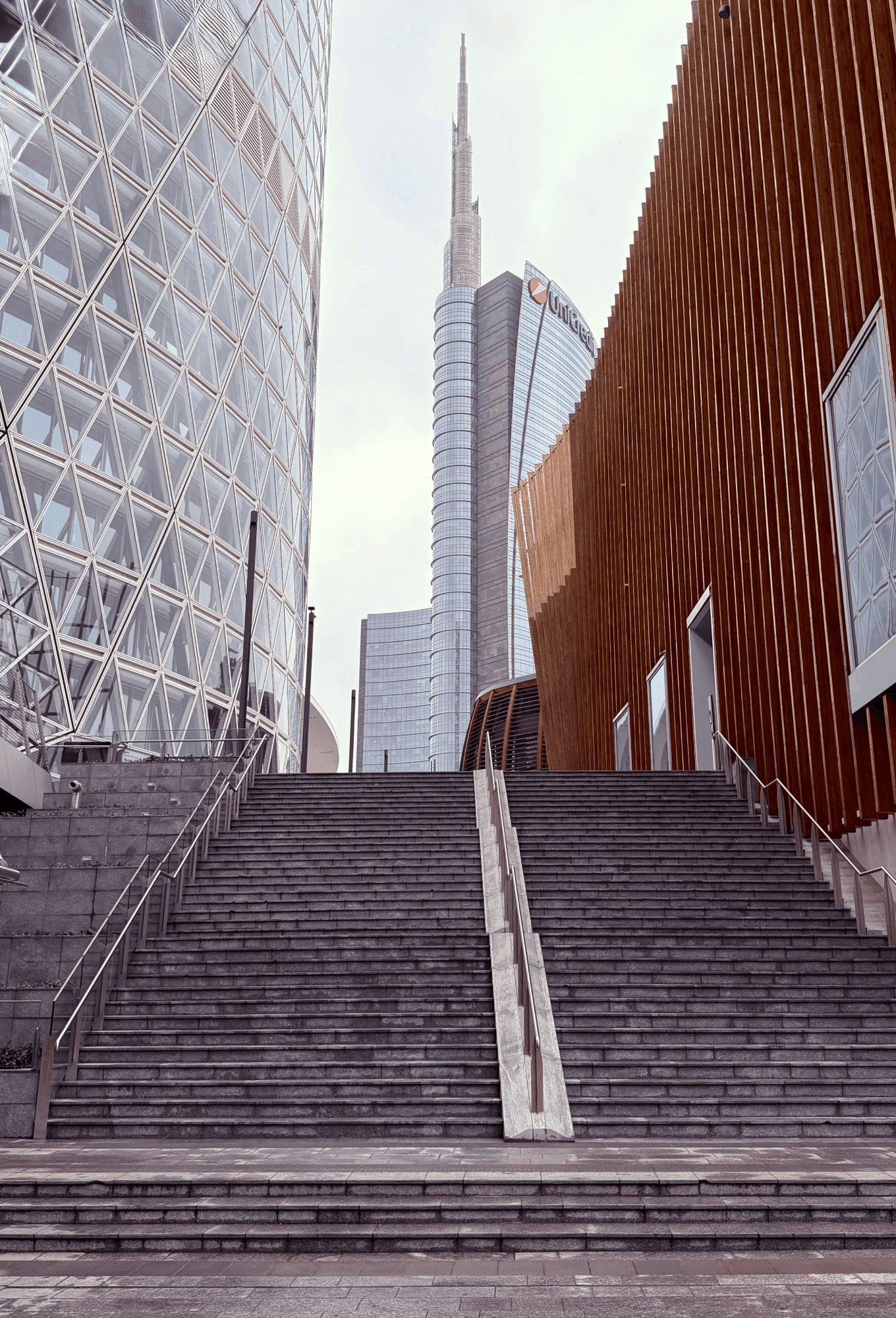 Modern architecture staircase in Milan with Unicredit Tower in background